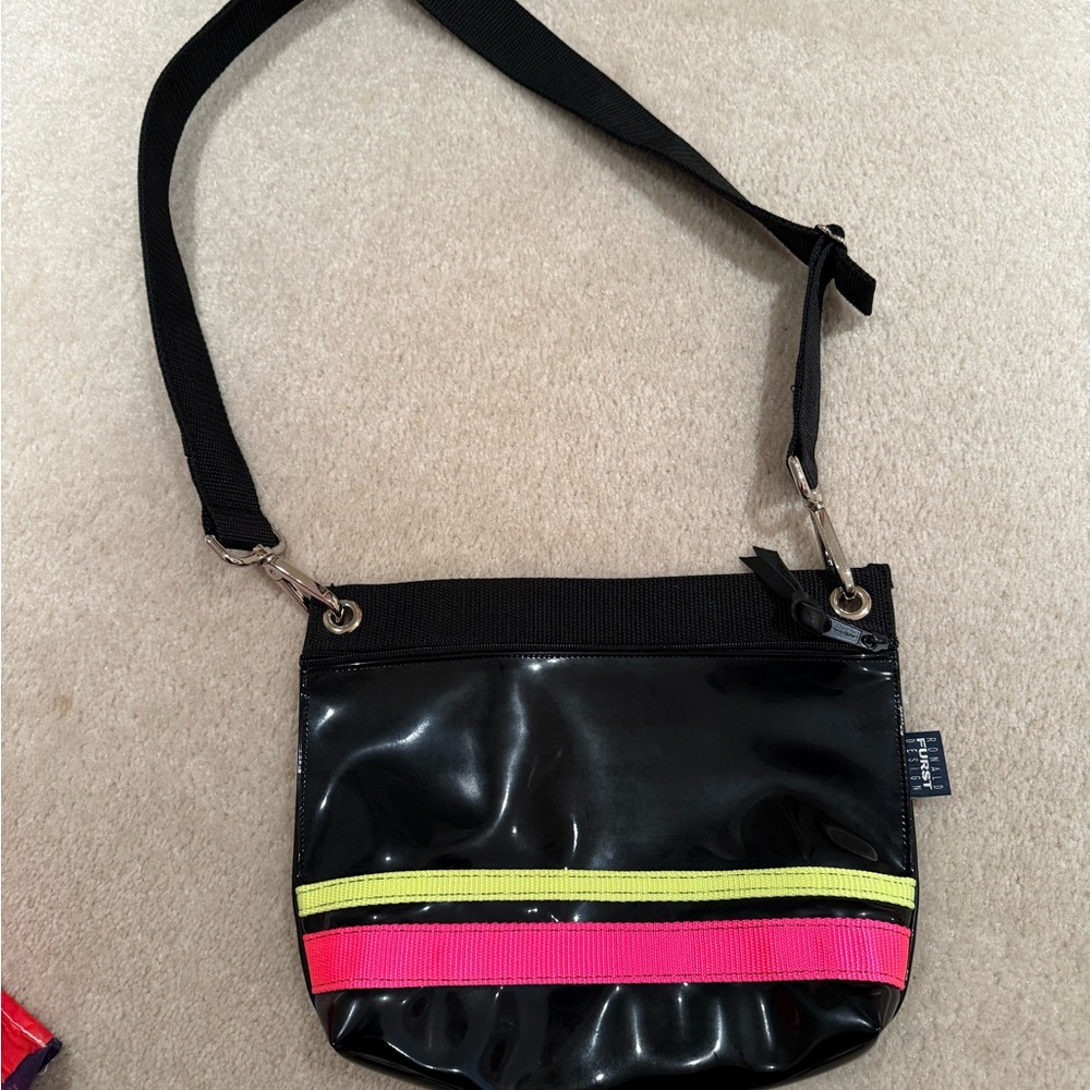 Ladies patent leather cross body bag black and hot neon pink